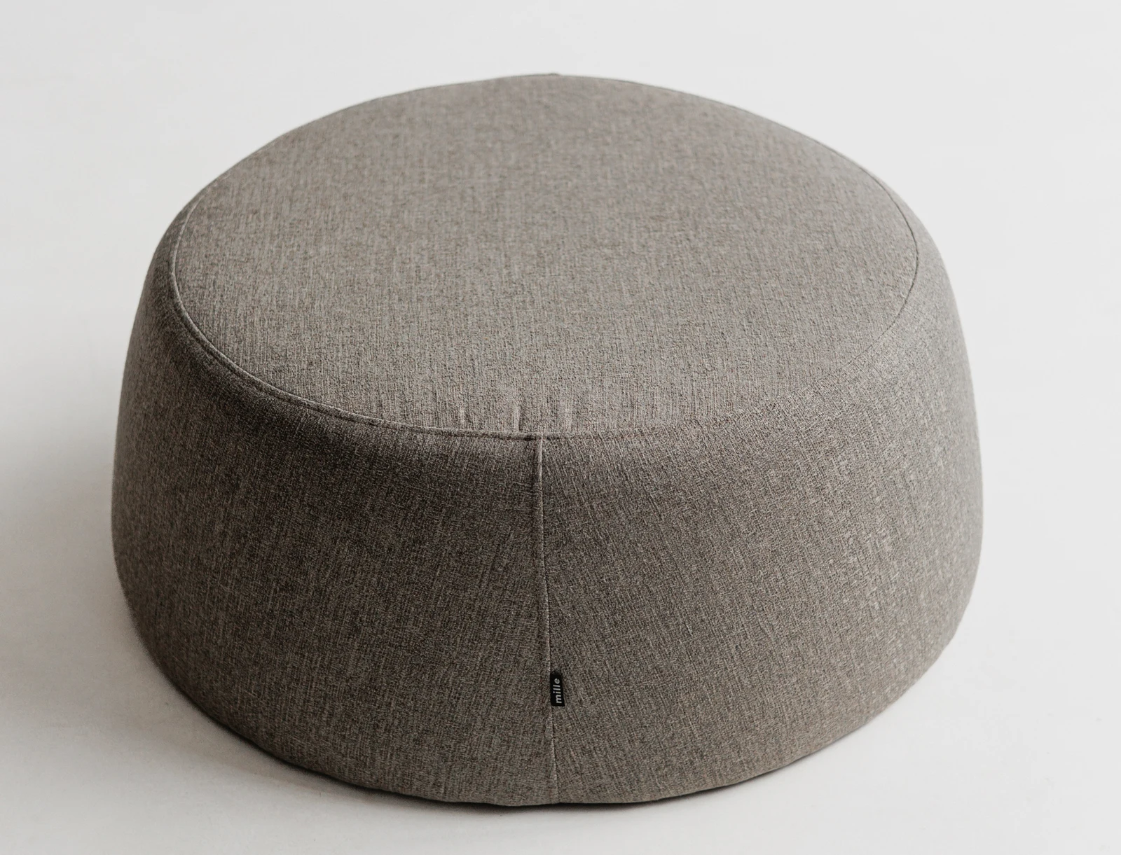 Top-down view of the Macarons pouf showing the round disc form