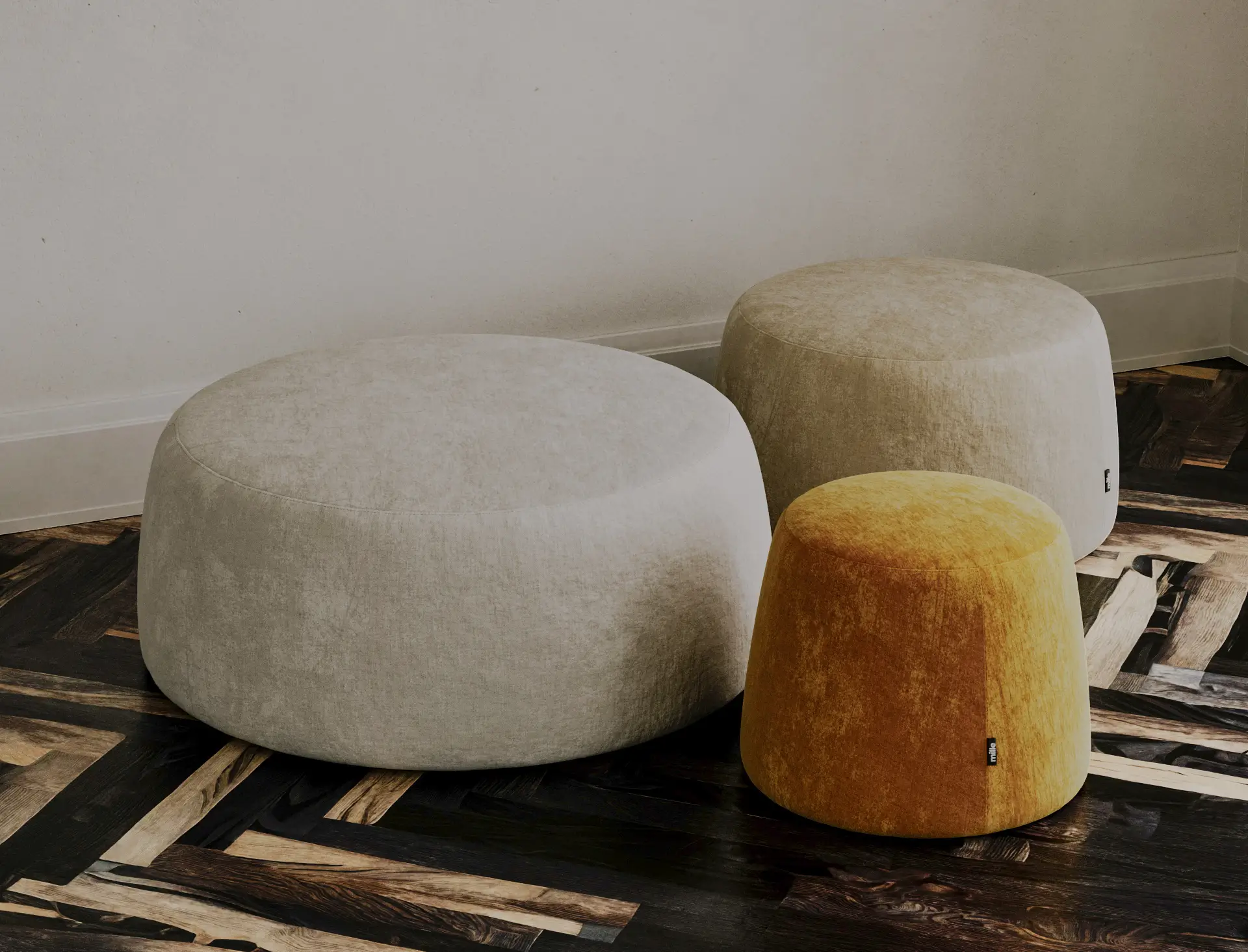 Three Macarons poufs in different sizes and colours together