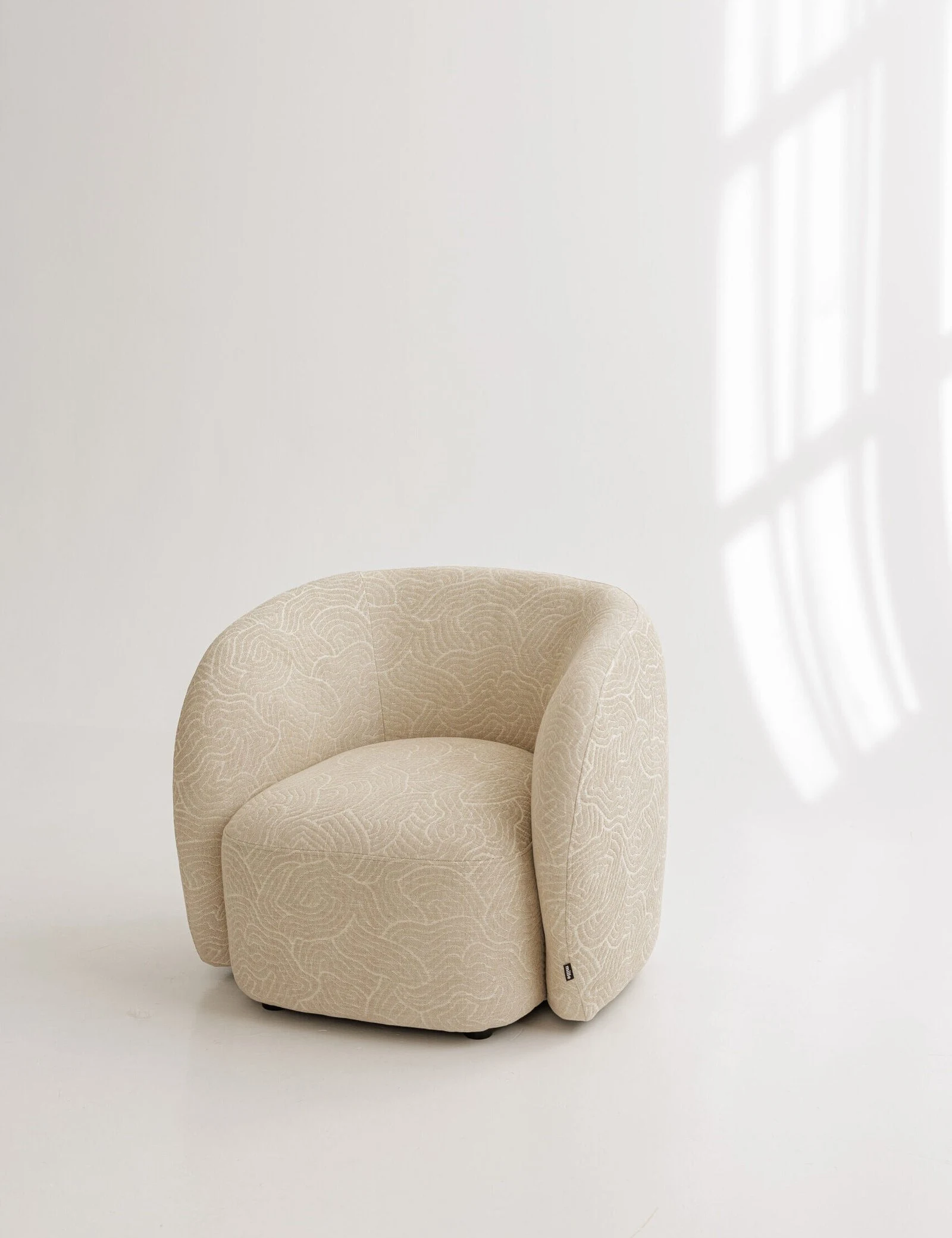 Argile 193003 Nuba armchair in a fine abstract line-pattern Belgian weave on natural ground, studio photographed
