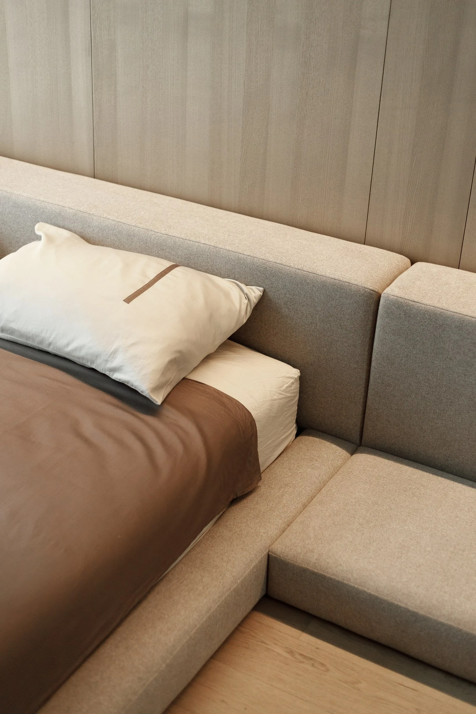 Three-quarter view of the Connect bench extension showing the cushion module meeting the bed body
