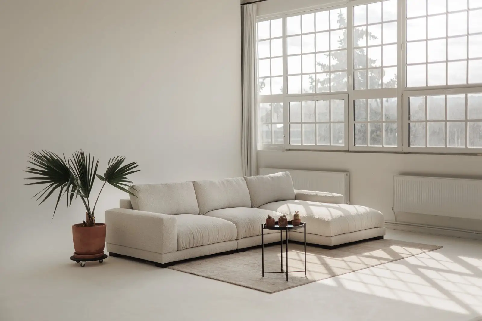 Close detail of cream boucle Palermo cushions and bolsters, soft texture