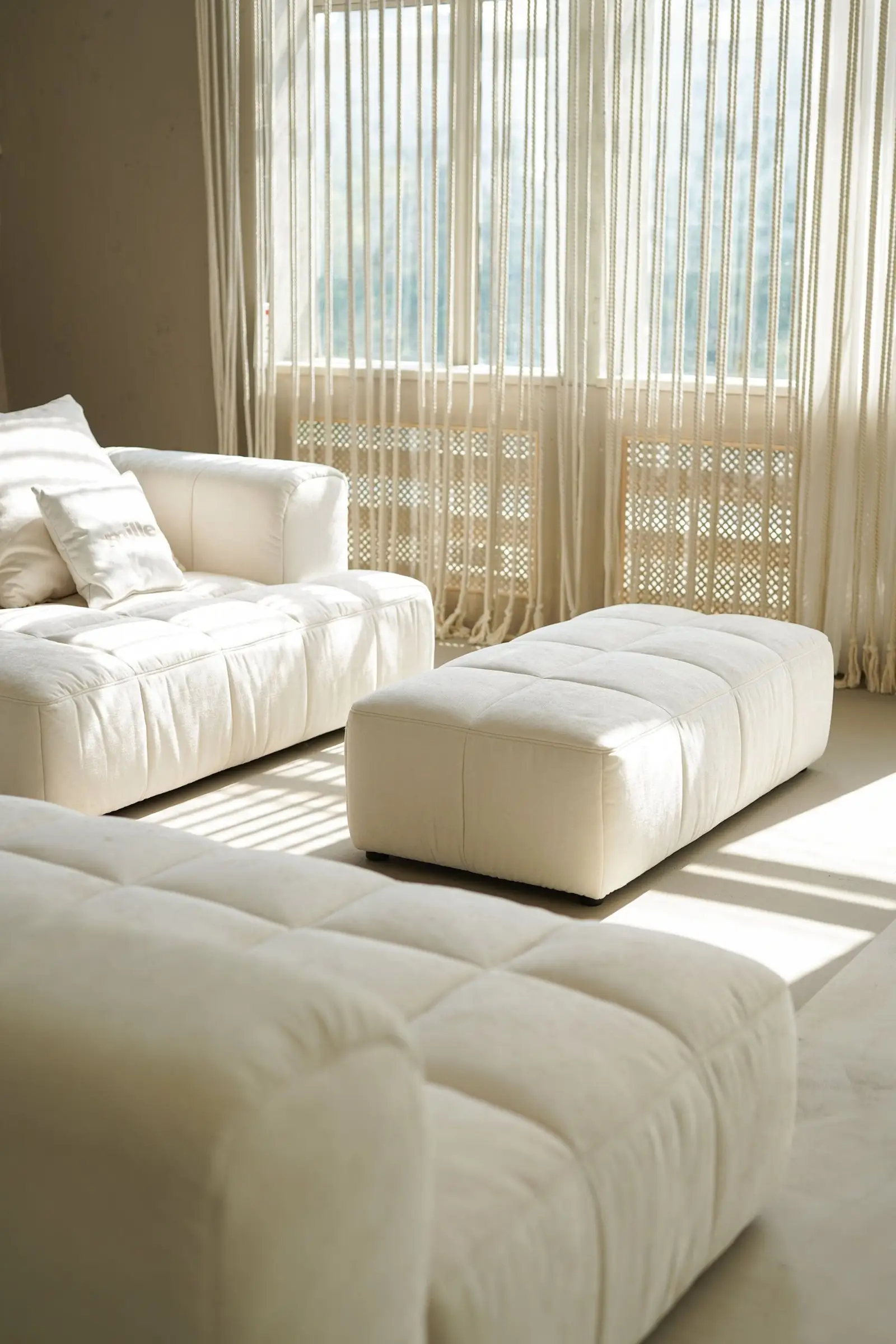 Mille pillow on cream Soft cushions with golden sun-stripes