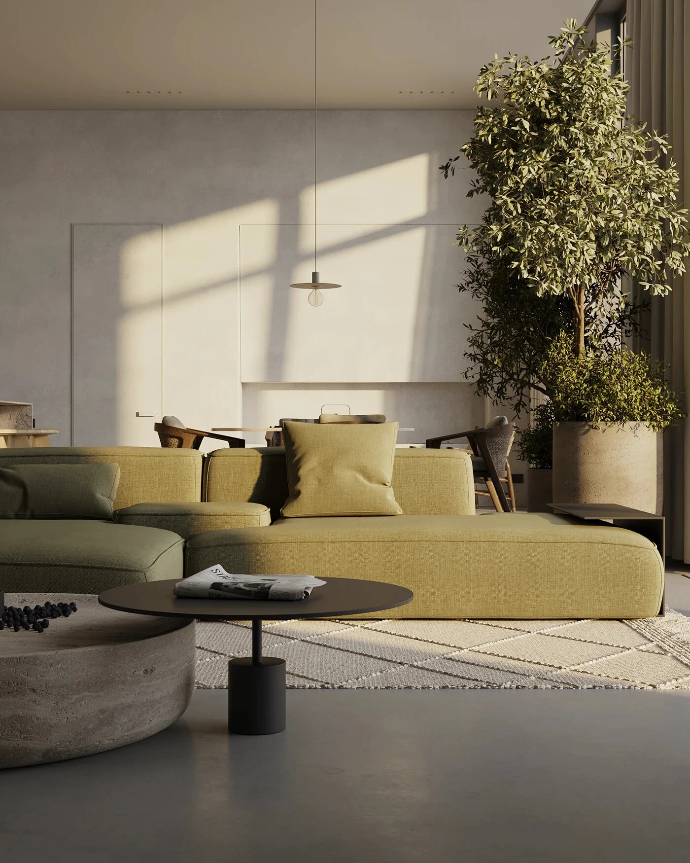 The Kingston sectional sofa in olive, in a sunlit room with a tall plant and warm light
