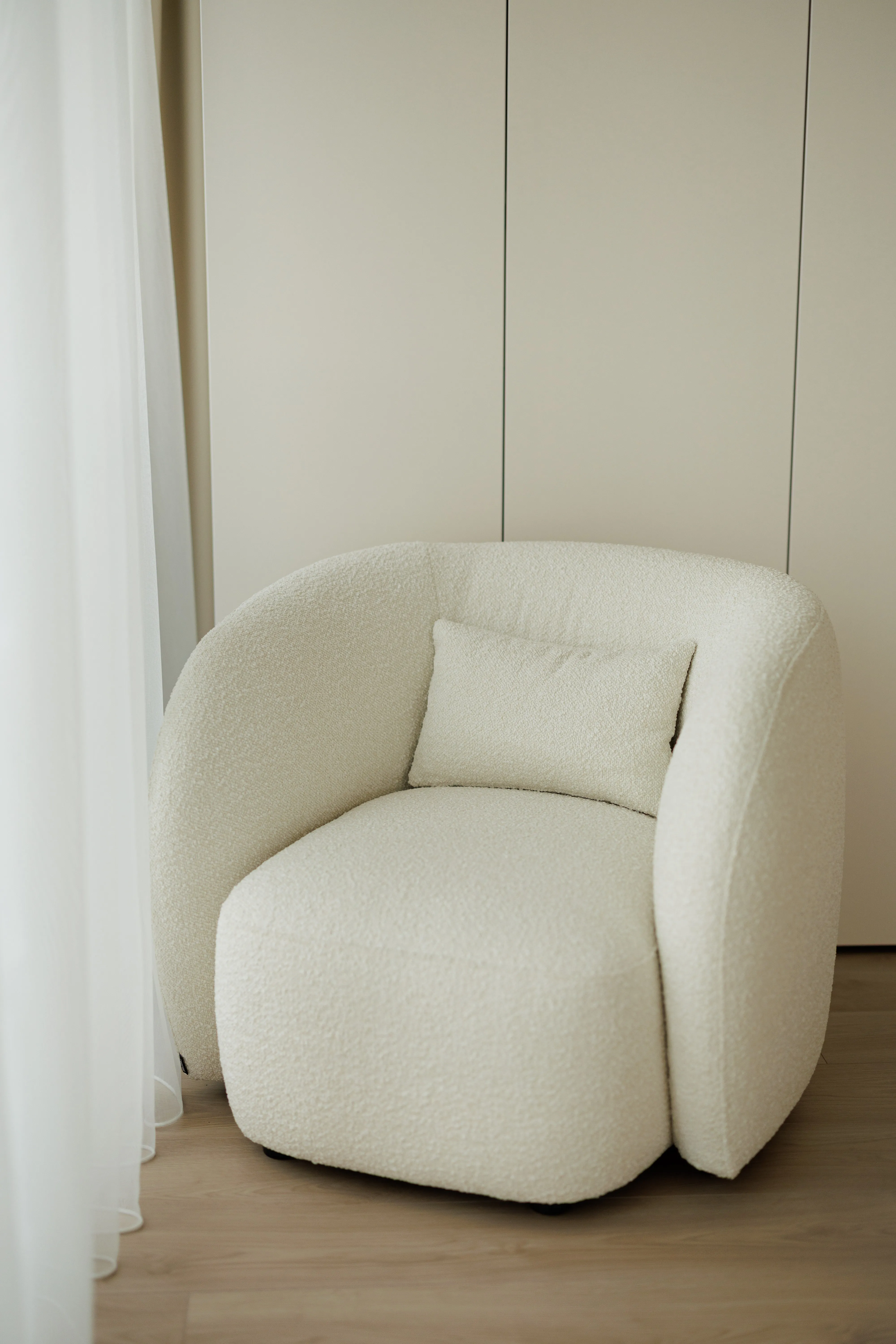 Nuba, Wraparound boucle armchair