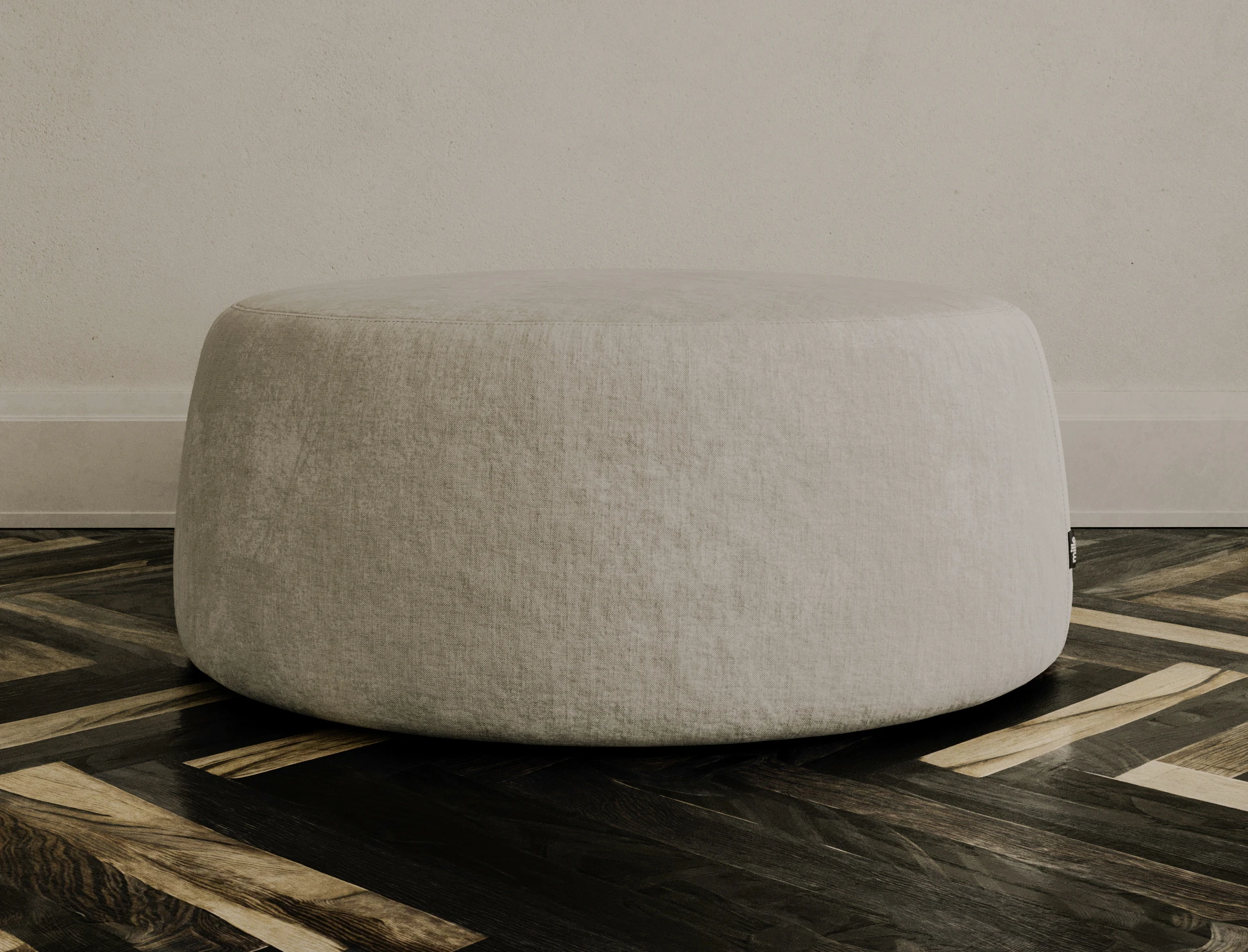 Cream Macarons pouf in a styled interior on a parquet floor