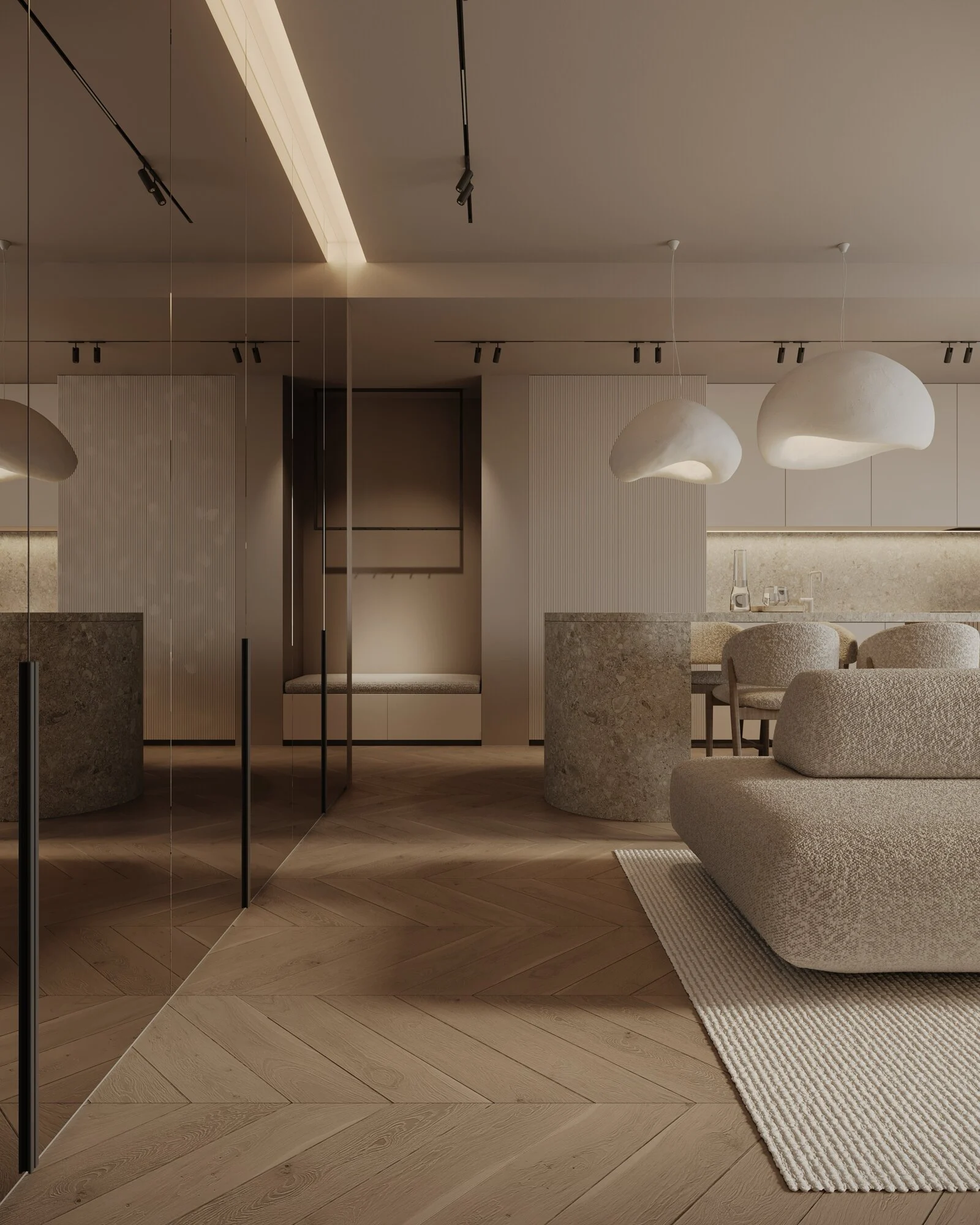 The Deseda lounging sofa in cream boucle beneath sculptural cream pendants in a styled apartment