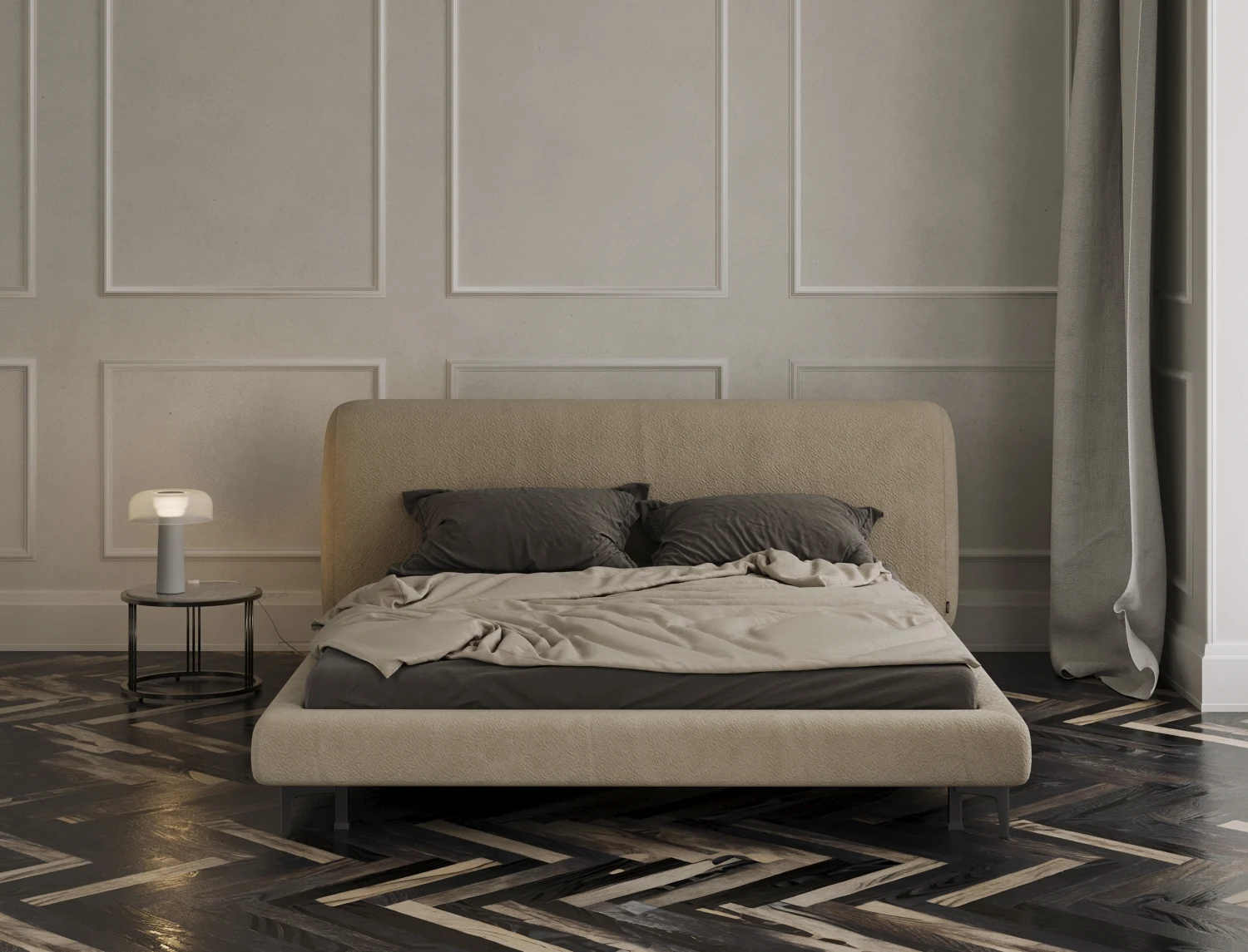 Sand boucle Fresco bed in a classical bedroom with white wainscot panel walls, dark herringbone parquet, a grey duvet draped and a soft glass table lamp on the side